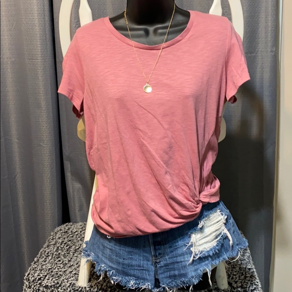 Women’s light pink top.